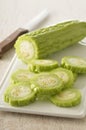 Slicing a bitter cucumber Royalty Free Stock Photo