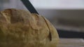 Slicing bread in slow motion