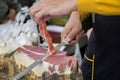 Slicing dry-cured ham prosciutto Royalty Free Stock Photo