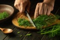 Slicing fennel by the hands of a cook using a knife on a kitchen cutting board. Preparing food for canning Royalty Free Stock Photo