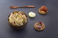 Slicing fermented green tomatoes and cucumbers with onions pickled garlic in a wooden bowl Royalty Free Stock Photo