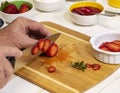 Slicing Fresh Strawberries on Cutting Board III Royalty Free Stock Photo