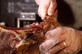 Slicing jamon at the butcher's shop. Close-up. Royalty Free Stock Photo