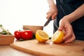 slicing lemon on the board with a knife kitchen cooking ingredients Royalty Free Stock Photo