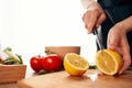 slicing lemon on the board with a knife kitchen cooking ingredients Royalty Free Stock Photo