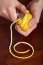 Slicing lemon with citrus decoration knife Royalty Free Stock Photo