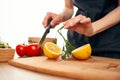 slicing lemon on a cutting board kitchen vegetables cooking Royalty Free Stock Photo