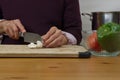 Slicing mushrooms with other ingredients around