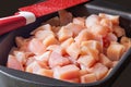Slicing pieces of diced chicken breast