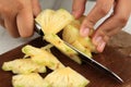 Slicing Pineapple on Wooden Chopping Board Royalty Free Stock Photo