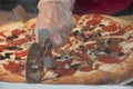 Slicing pizza Royalty Free Stock Photo