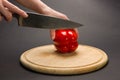 Slicing red pepper on chopping board Royalty Free Stock Photo