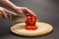 Slicing red pepper on chopping board Royalty Free Stock Photo