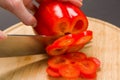 Slicing red pepper on chopping board Royalty Free Stock Photo
