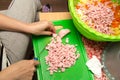 Slicing sausage with a knife on the board