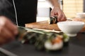 Slicing sushi with crab, salmon, cucumber Royalty Free Stock Photo