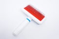 Slicker brush, To remove hairballs or clumps of fur