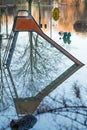 Slide on a flooded playground with reflection in the water. Royalty Free Stock Photo