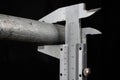 Slide gauge measuring a metal pipe Royalty Free Stock Photo