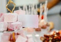 Slide of pink marshmallow with advertising card