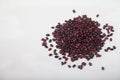 A slide of red raw beans sprinkled on a white background. Healthy lifestyle. Copy spaes