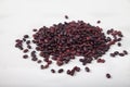 A slide of red raw beans sprinkled on a white background. Healthy lifestyle. Top view
