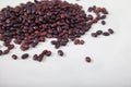 A slide of red raw beans sprinkled on a white background. Vegan protein. Top view