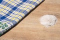 A slide of salt on a wooden countertop, a beautiful kitchen towel. Cooking in your kitchen