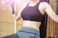 Slide view of fitness woman exercising with running on treadmill