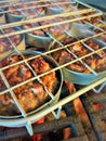 Slider Rack with Pork Mini-Burgers on the Grill Royalty Free Stock Photo