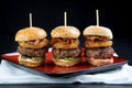 Sliders beef tall mini burgers sharing food Royalty Free Stock Photo