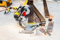 Sliding Compound Miter Saw and Flooring Wood Planks Outdoors Royalty Free Stock Photo