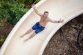 Sliding down a fun water slide at a waterpark Royalty Free Stock Photo