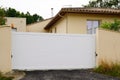 Sliding gate metal white home facade on suburb house