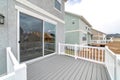 Sliding glass door at the deck of home with scenic view of the neighborhood