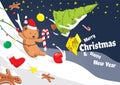 Sliding joyful teddy bear on the snow messing with christmas ornamets Royalty Free Stock Photo