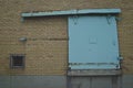 The sliding teal door on the old factory Royalty Free Stock Photo