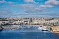 Sliema harbor with modern buildings and sail boats