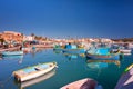 Sliema, Malta - January 10, 2020: Traditional fishing boats in the Mediterranean Village of Marsaxlokk, Malta Royalty Free Stock Photo