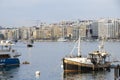 Boats moored in a bay and a view on Sliema waterfront, Malta