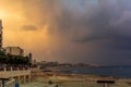 Dramatic blue to orange sky over Sliema beach