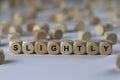 Slightly - cube with letters, sign with wooden cubes Royalty Free Stock Photo