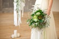 Slightly disheveled fresh and airy bridal bouquet with a grinn ball, brunia, eringum, eustoma, asparagus and eucalyptus in the