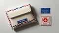 Vintage Airmail Envelope and Stamps on a Light Surface Royalty Free Stock Photo