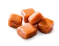 Slightly melted toffee caramel candy close-up isolated with clipping path on white Royalty Free Stock Photo