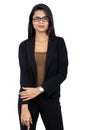 Slightly smiling Indian businesswoman in black clothes on white background - both hands down Royalty Free Stock Photo