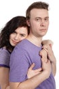 Slightly smiling woman embraces man from behind Royalty Free Stock Photo