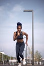 Slim athlete female runs in city