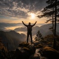 Slim backpacker revels in foggy mountain panorama, arms raised against vivid morning sky Royalty Free Stock Photo