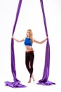 Beautiful girl aerial acrobat stands with fabric